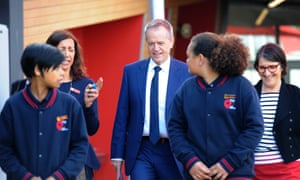 Bill Shorten and Calwell MP Maria Vamvakinou (right) with students during a visit to the School of the Good Shepard in Gladstone Park, Victoria on Thursday.