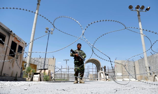 An Afghan national army soldier stands guard at Bagram on the day the last of the American troops vacated the airbase