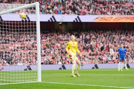Arsenal goalkeeper Daphne van Domselaar watches as a shot from Chelsea's Alyssa Thompson flies past her and into the net