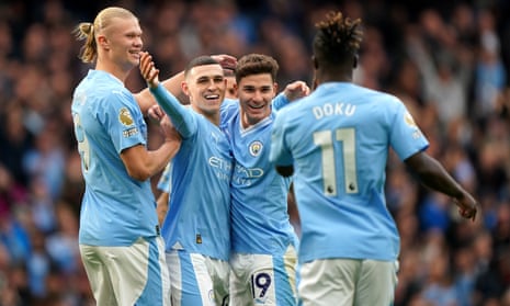 Manchester City's Julian Alvarez (second right) celebrates with teammates after scoring their side's first goal of the game against Brighton.