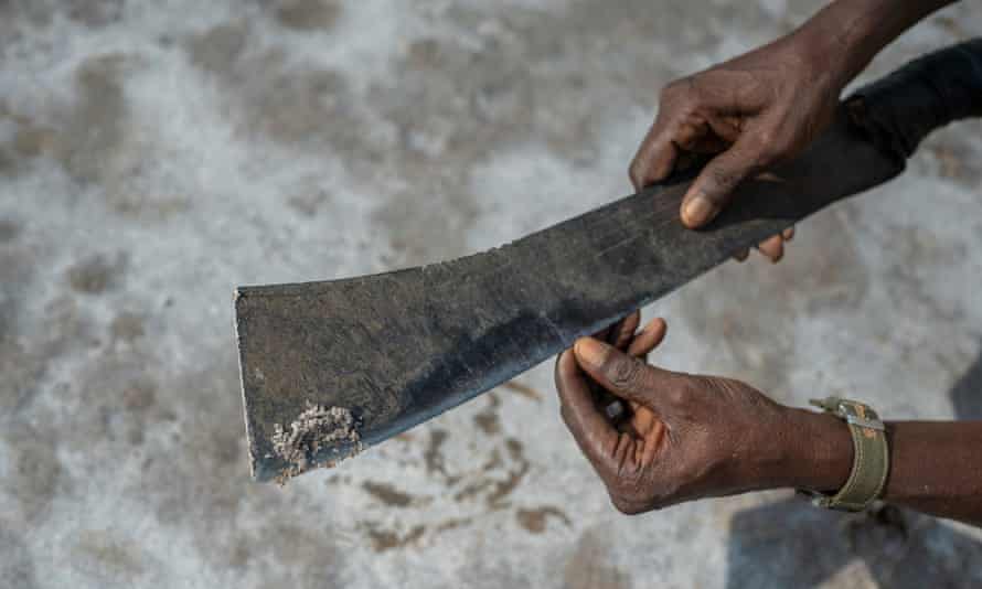 Salt held up on the tip of a machete