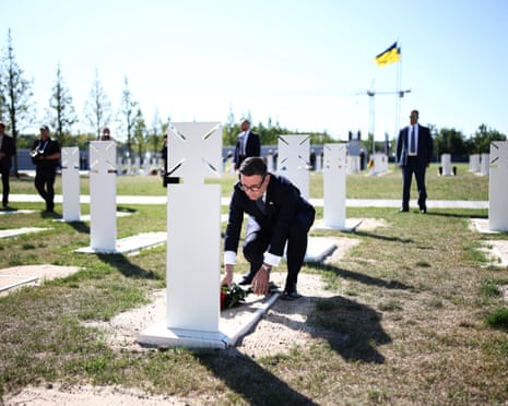 Britain's prime minister Andy Burnham lays a wreath of flowers at the tomb of the unknow soldier during a ceremony at Ukraine's national military memorial cemetery in Hatne, Ukraine.