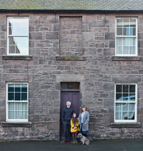 Illustrators Helen Stephens and Gerry Turley, with their daughter, Frieda, and dog Peggy outside their house in Berwick-upon-Tweed