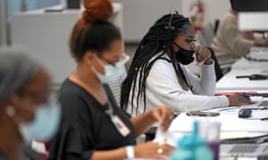 Contact tracker Kandice Childress, right, works at Harris County, Public Health Tracking Contact, June 25, 2020, in Houston.