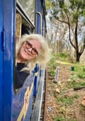 Linda looking out of a railway carriage window.