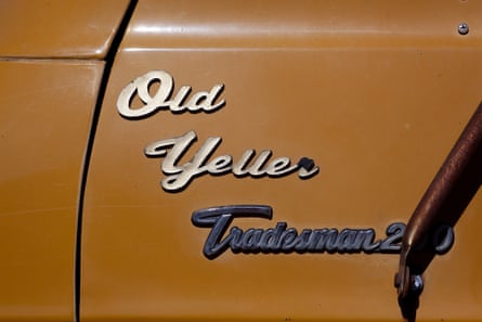 An applique saying ‘Old Yeller’ on the outside of a yellow van