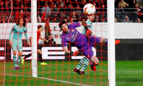 Arsenal’s Nacho Monreal deflects the cross of Mehdi Zeffane into the net to give Rennes the lead.