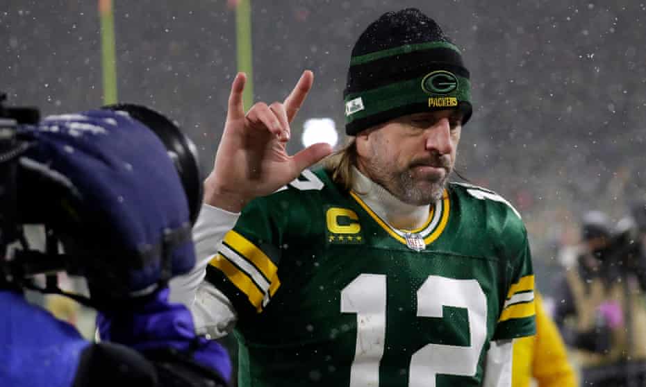 Aaron Rodgers signals his love to the fans following Green Bay's home playoff loss to the 49ers