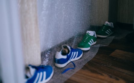Shoes weighing down bubble wrap pinned up against the door