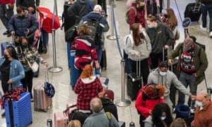 Travellers seen in line at the Delta Air Lines check in counter at Hartsfield-Jackson Atlanta International Airport in Atlanta, Georgia, as hundreds more flights are cancelled in the fifth day of travel chaos.