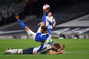 Brighton’s English midfielder Adam Lallana (top) fouls Tottenham Hotspur’s English striker Harry Kane (bottom) leading to a penalty.