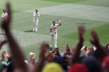 Mitchell Starc is applauded off the field after his career-best seven-for