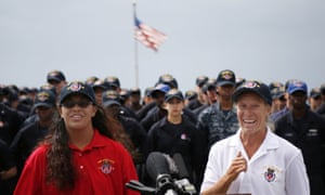 Tasha Fuiava (left) and Jennifer Appel speak on the deck of the USS Ashland at White Beach naval facility in Okinawa on Monday.