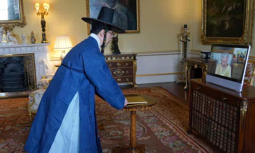Queen Elizabeth appears on a screen via video link from Windsor Castle during a virtual audience to receive the Ambassador from Korea.