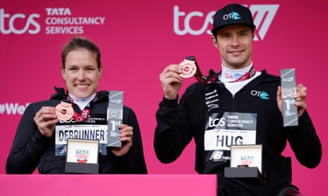 Catherine Debrunner and Marcel Hug of Switzerland pose with their medals after winning their elite wheelchair race at the London Marathon