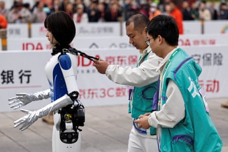 Engineers run with a humanoid robot