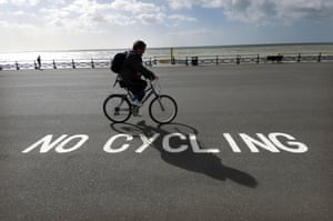 A cyclist ignoring a ‘no cycling’ sign on Brighton seafront, 2009
