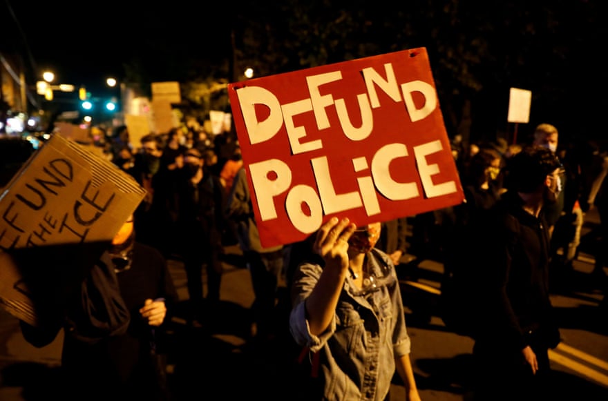 sign says 'defund police'