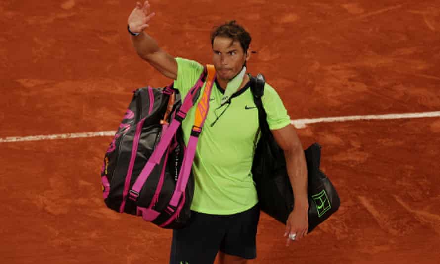 Rafael Nadal waves to the crowd after his loss in Paris