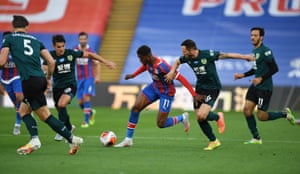 Crystal Palace’s Wilfried Zaha is challenged by Burnley’s Phil Bardsley.