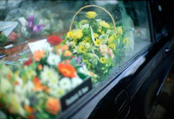 Detail of flowers in window of a hearse