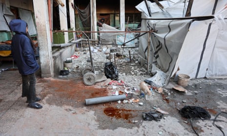 A girl stands at the site of an Israeli airstrike that targeted the Musa Bin Nusayr school in the al-Daraj neighbourhood in Gaza City on 22 December 2024.