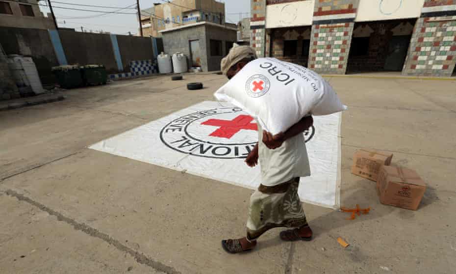 A displaced man receives aid distributed by the International Committee of the Red Cross in Hodeidah, Yemen.