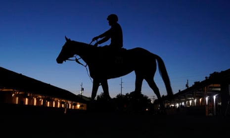 A horse is ridden to the track for an early morning workout before the 149th running of the Kentucky Derby this weekend