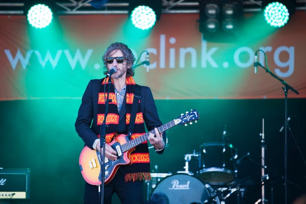Tim Rogers playing at half-time at the Community Cup in 2013.