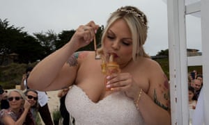 The bride takes a hit at a marijuana-themed wedding in Carmel, California.