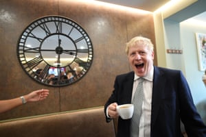 Boris Johnson holding a coffee cup