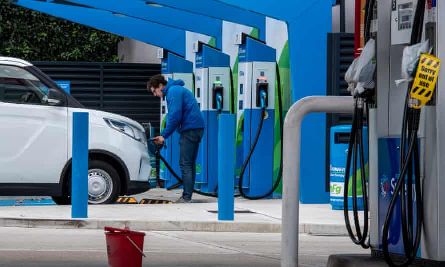 A motorist plugs his electric van to a charge point last week while petrol and diesel pumps are closed. Two-thirds of people polled by Greenpeace UK in 41 Tory seats want to see more investment in electric vehicles.