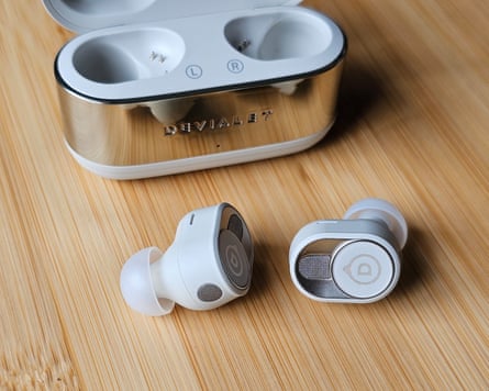A pair of Devialet Gemini II earbuds