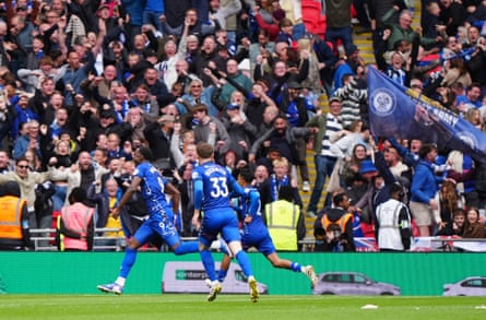 Mani Dieseruvwe races away in delight after scoring a dramatic equaliser for Rochdale