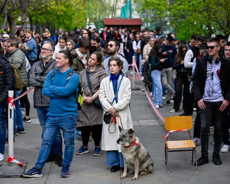 People queue up outside a polling station during the Hungarian parliamentary election in Budapest, Hungary.