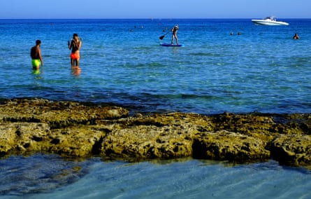 Tourist enjoy the sea at ‘Landa’ beach in the southern coastal resort of Ayia Napa in south-east Mediterranean island of Cyprus