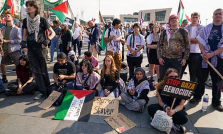 Pro-Palestinian protesters in Liverpool, England, with signs and flags