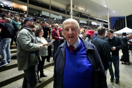 A man in the stands of a racing track