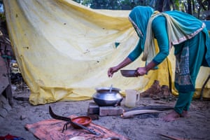 A woman prepares a meal in Kutubdia para, in Cox’s Bazar