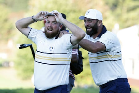 Jon Rahm congratulates Shane Lowry on securing the 2025 Ryder Cup for Europe at Bethpage Black Golf Course in Farmingdale, New York.