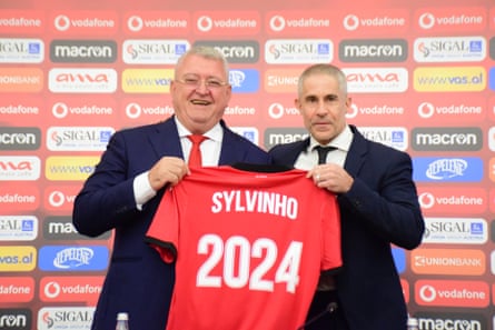 Sylvinho at an on-the-nose unveiling with Albanian FA president Armand Duka.