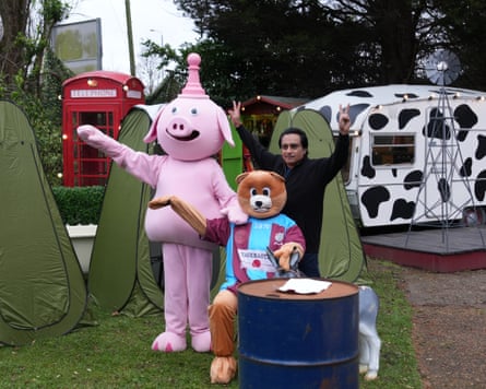 Sanjeev Bhaskar and person dressed as pink pink and person in bear costume wearing Taskmaster football strip
