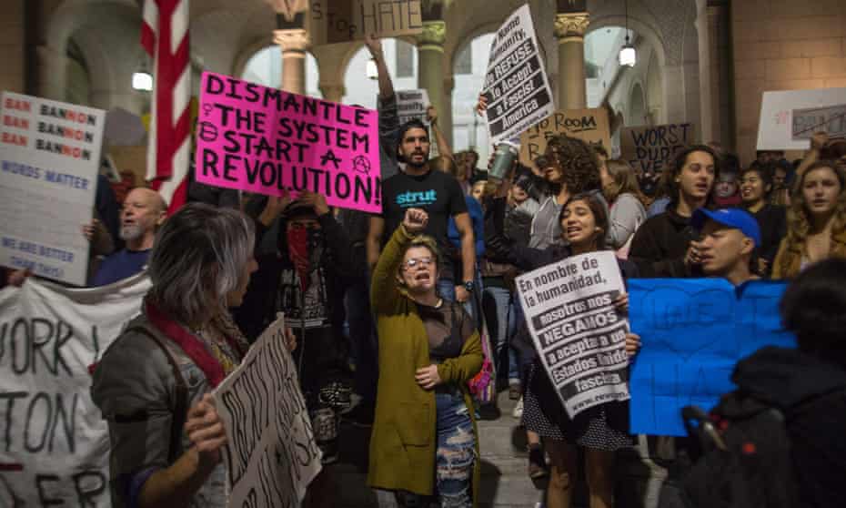 People protest against the appointment of former Breitbart News head Stephen Bannon to be chief strategist of the White House by president-elect Donald Trump near City Hall in Los Angeles.