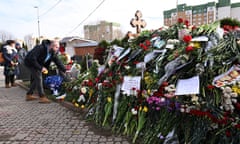 Mourners visit the grave of late Russian opposition leader Alexei Navalny at the Borisovo cemetery in Moscow.