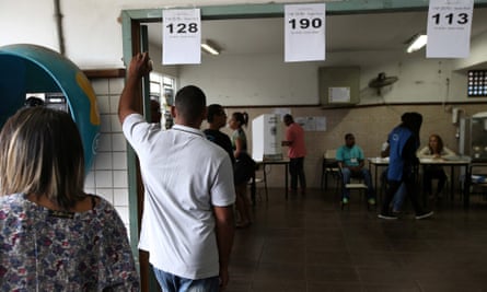 People queue to vote in the elections which have seen a record number of spoiled or blank ballots.