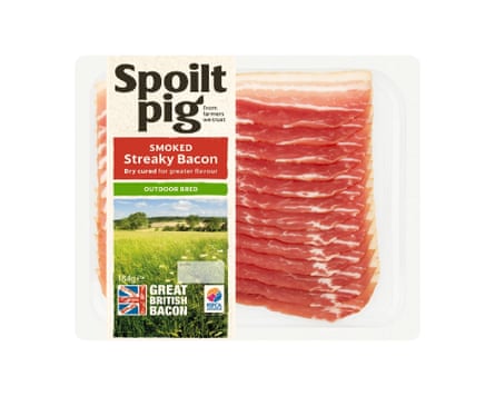 A packet of Spoilt Pig Dry Cured Smoked Streaky Bacon. There is a clear back and the rashers are clearly visible with a branded label wrapped around the left side.