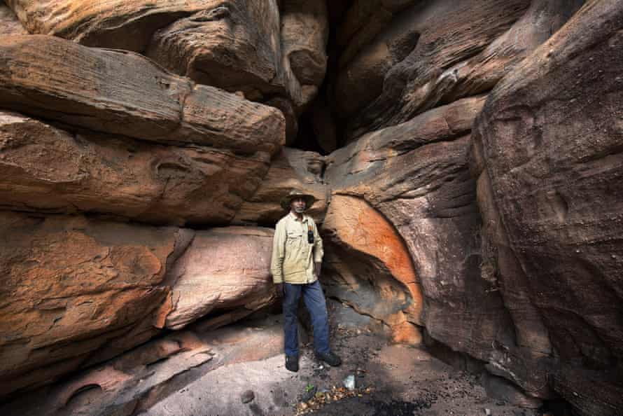 Senior landholder Ricky Nabarlambarl explores an area near Manmoyi outstation where Bininj have lived and sheltered for thousands of years.