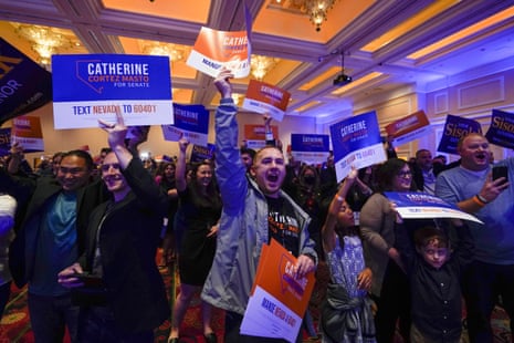 Supporters of Senator Catherine Cortez Masto, react as she speaks during an election night party in Las Vegas.