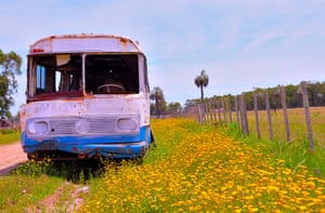 Derelict bus parked by the road, next to a field, in La Esmeralda, Uruguay