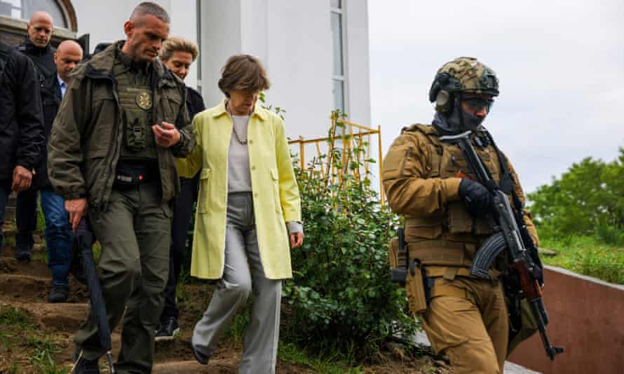 French foreign minister Catherine Colonna visits the site of a mass grave in the Ukrainian town of Bucha, near Kyiv